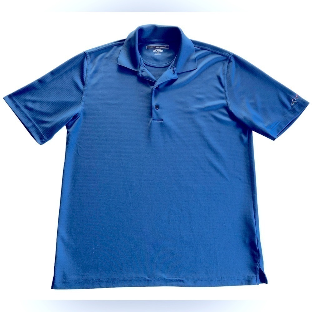 Greg Norman, 3- Button closure, Moisture Wicking. Dri Fit polo shirt. Size Med.